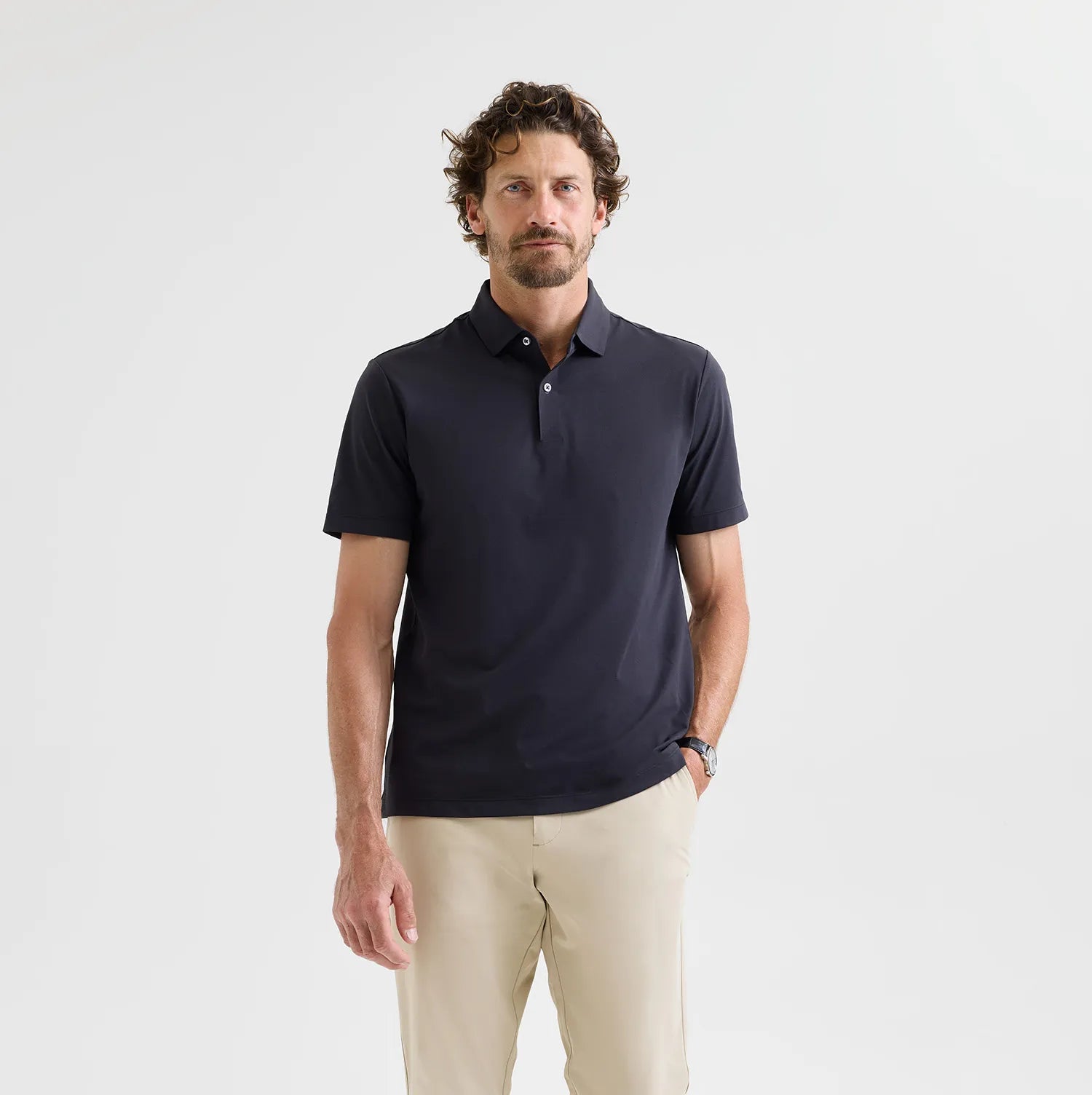 Black Como Travel Polo – a sleek, moisture-wicking polo designed for effortless travel and everyday luxury.