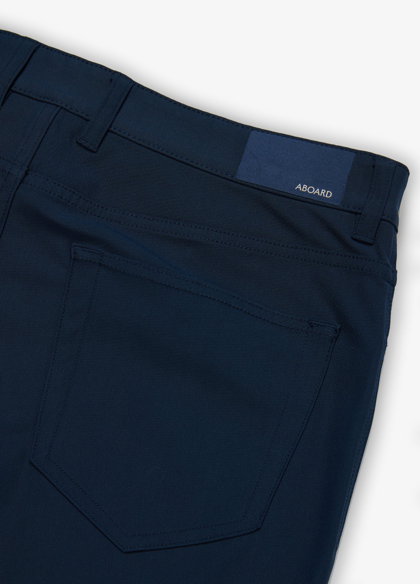 Four Seasons Travel Pant in Navy – Patch Back Pocket with Branded Patch #color_navy