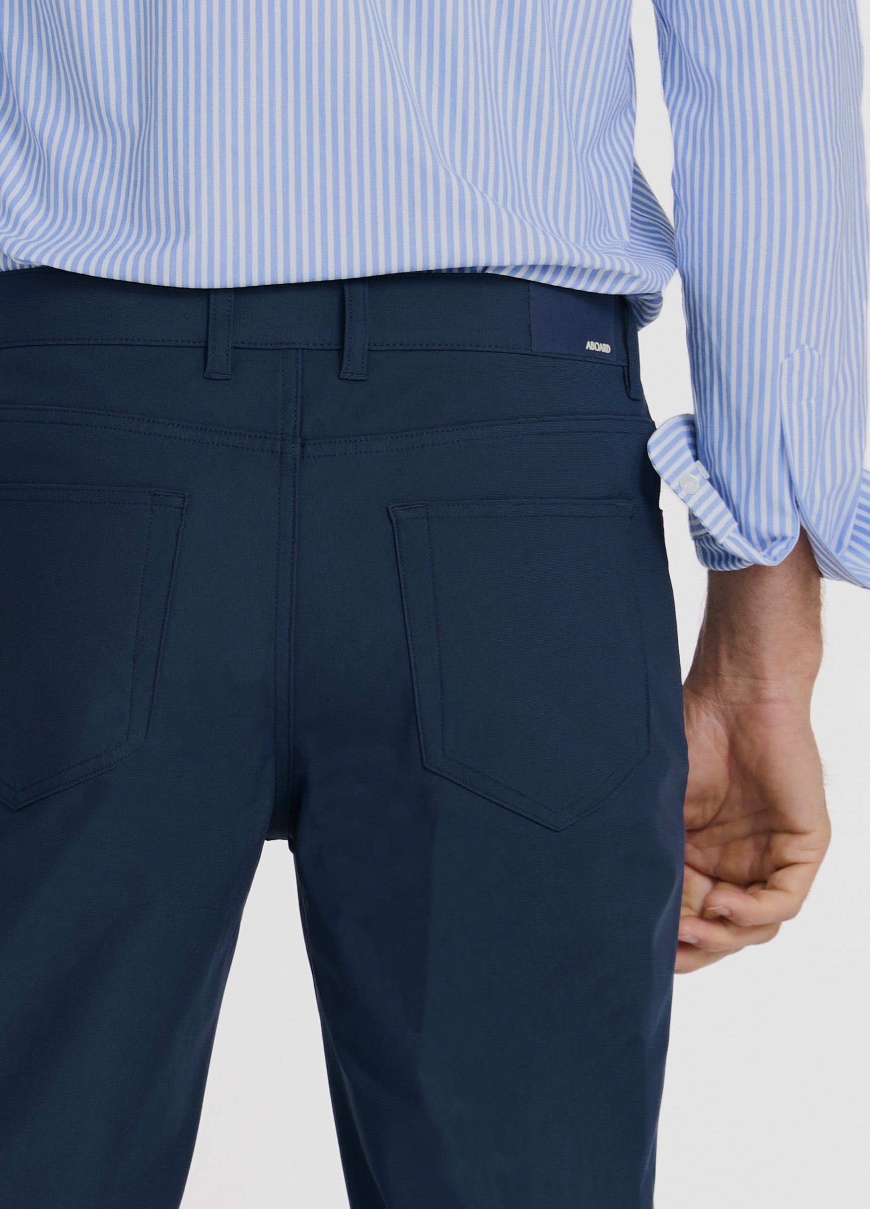 Four Seasons Travel Pant in Navy – Smart Back Pockets with Branded Patch #color_navy