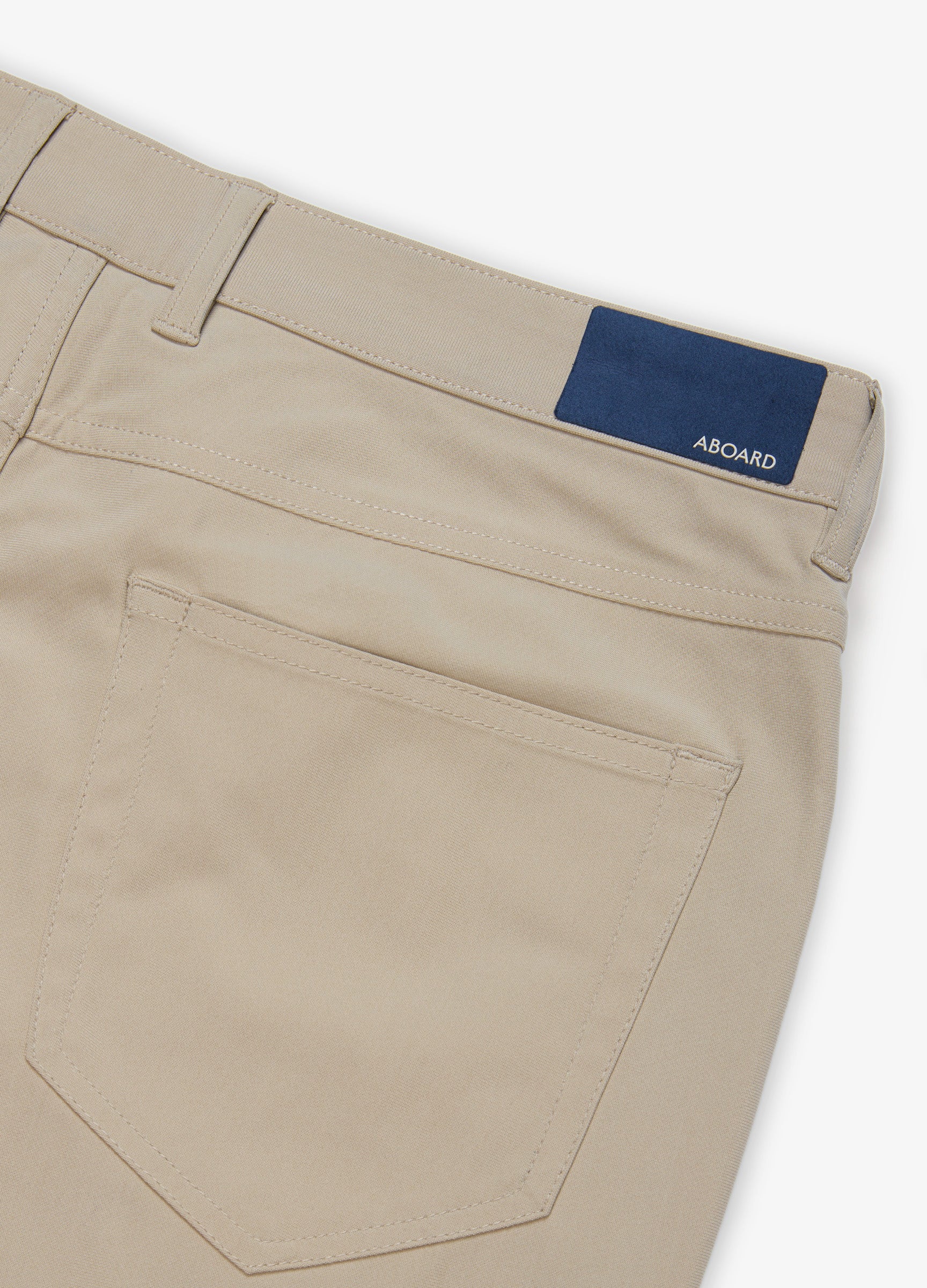 Four Seasons Travel Pant in Sand – Quality Back Pocket with Branded Patch #color_sand