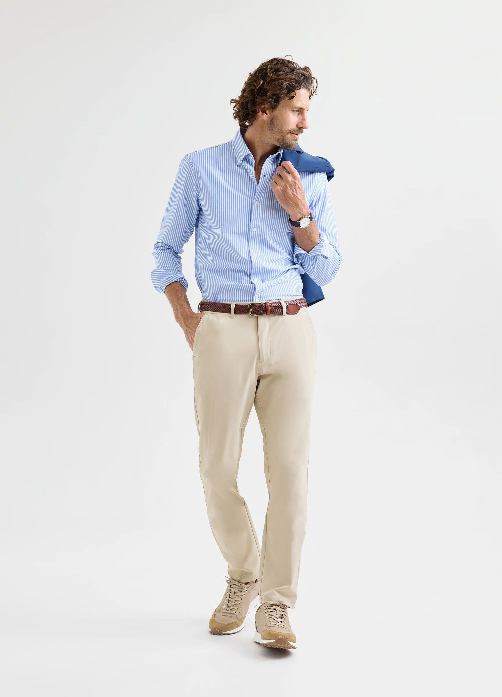 Man wearing Aboard Riviera Stripe Travel Shirt with blazer and chinos — business travel outfit