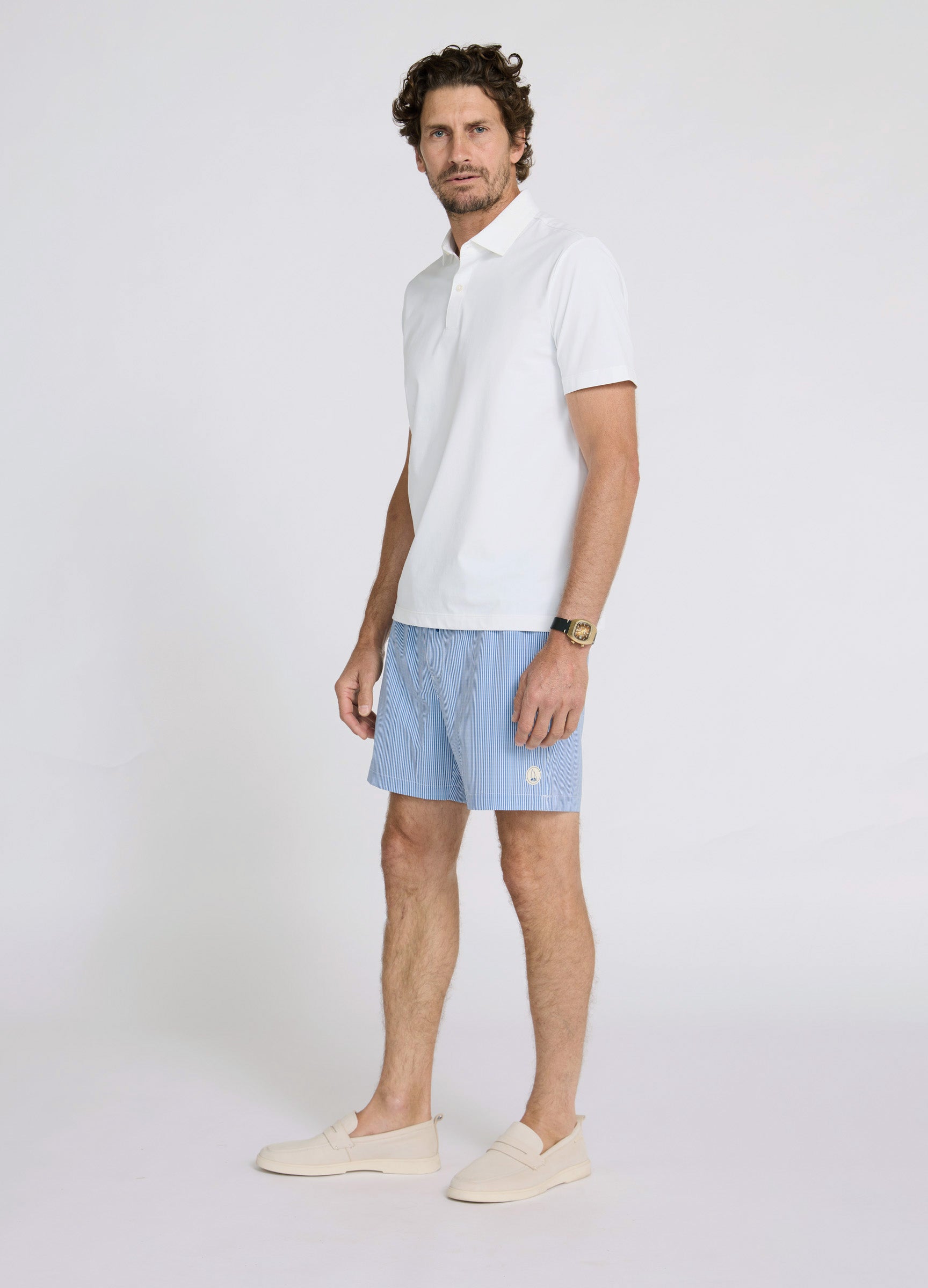 Noosa Swim Short styled with casual summer outfit, modern traveller look