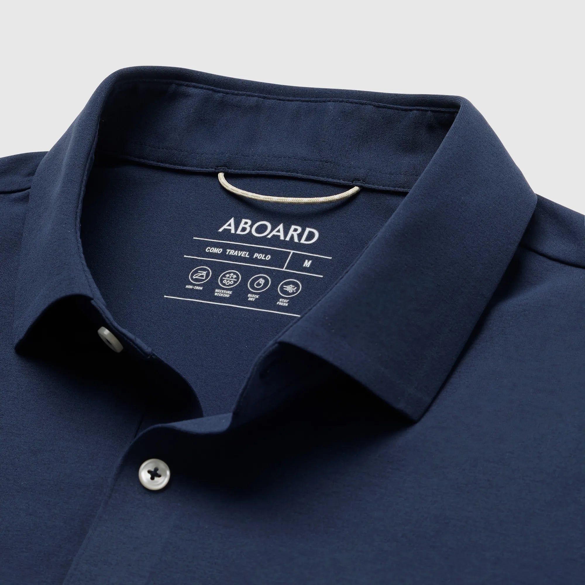Navy Como Travel Polo – bonded collar for a smarter, structured look, with a refined placket for added durability.