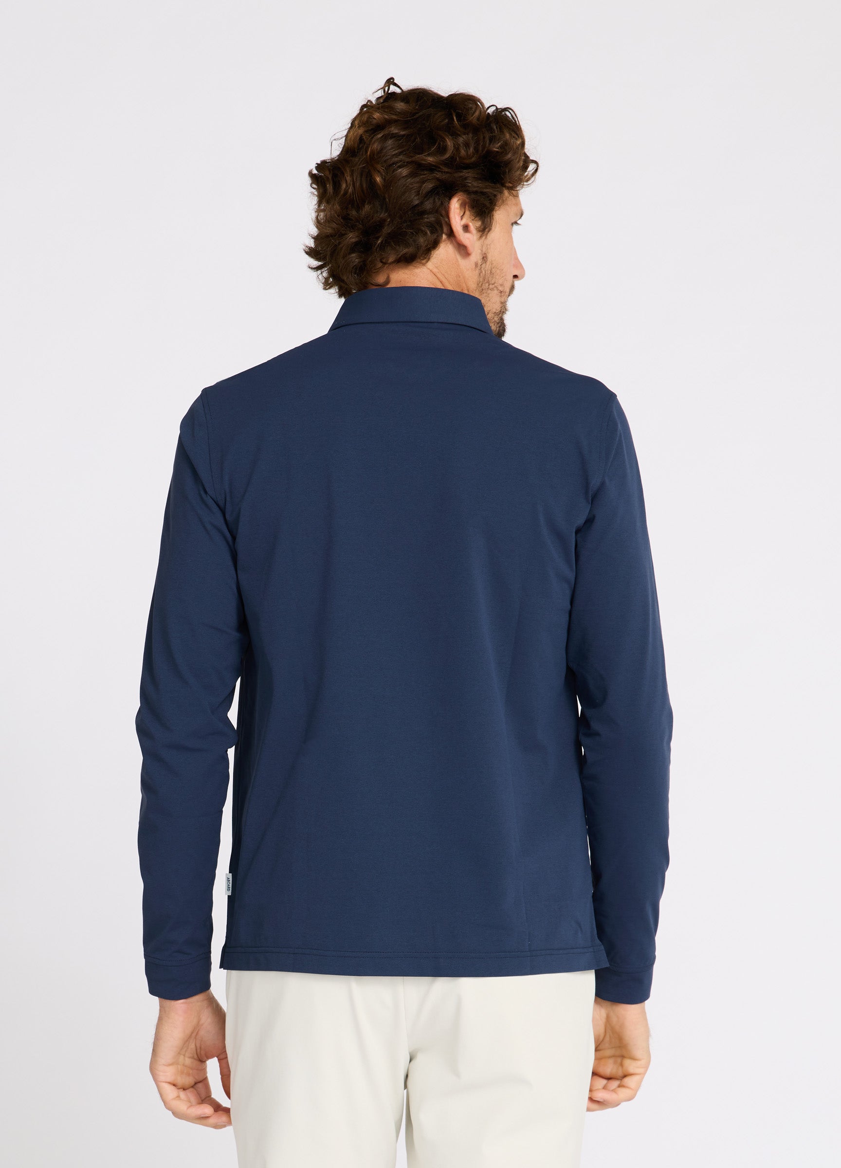 Como Long Sleeve Travel Polo in Navy – Back View, Performance Polo with Sun Protection & Timeless Style #color_navy
