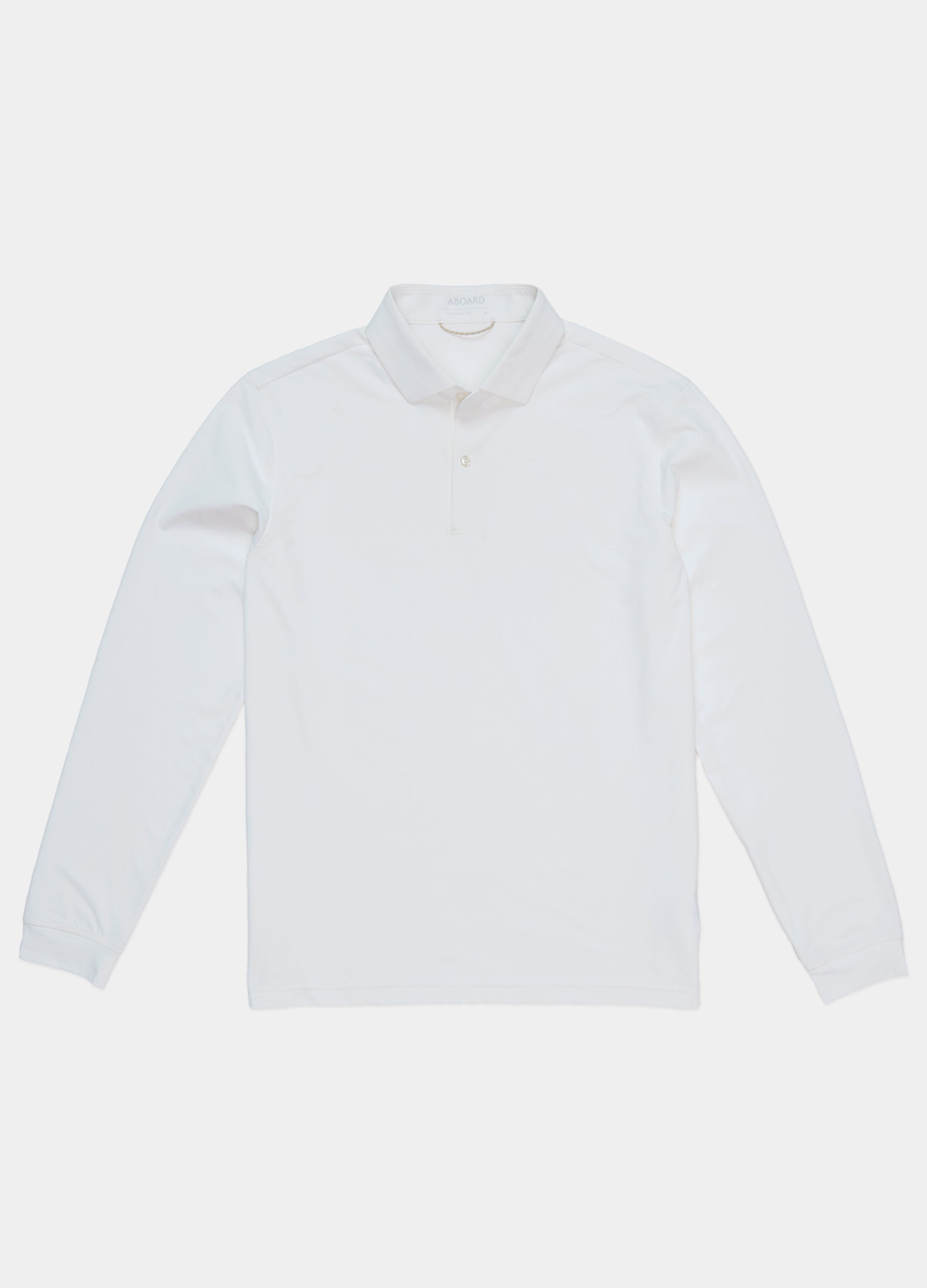 Como Long Sleeve Travel Polo in White – Front Flat Lay, Performance Polo with Sun Protection & Timeless Style #color_white