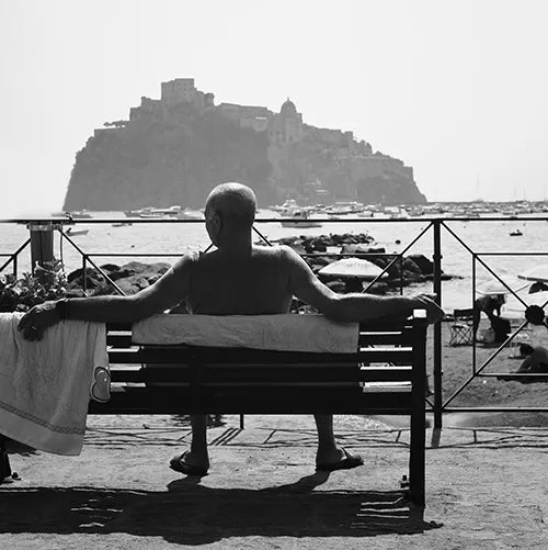 Man relaxing in France. ABOARD Apparel luxury travel clothing