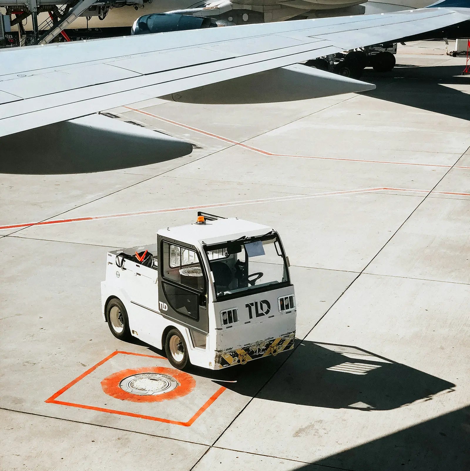 Airport runway with 'TRAVEL. Comfort for the long haul' – showcasing stylish, comfortable menswear designed for long flights and travel.