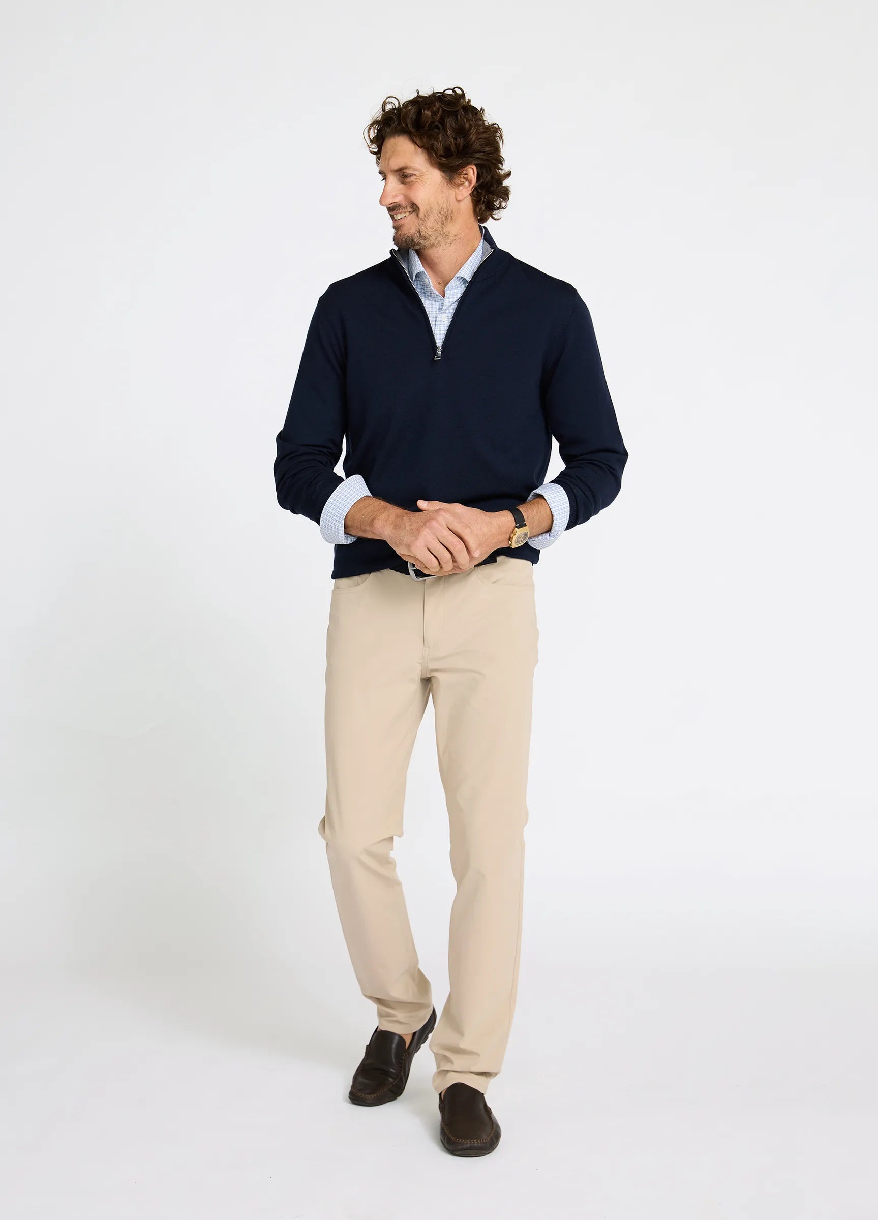 Mens outfit wearing Verbier Merino Travel Quarter Zip in Navy styled with tailored chinos for travel #color_navy