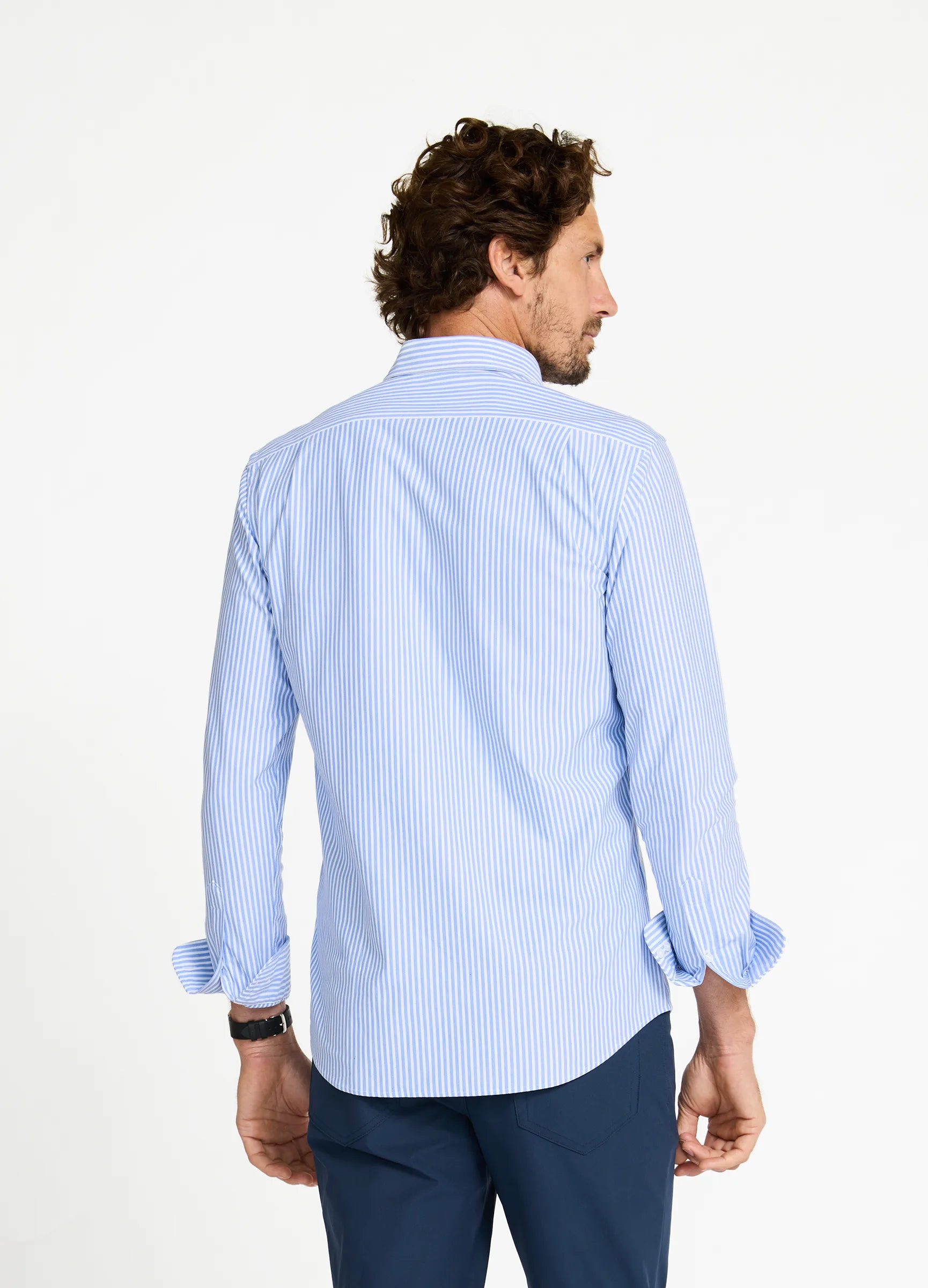 Aboard Riviera Stripe Knit Oxford Travel Shirt — blue stripe tailored fit back view