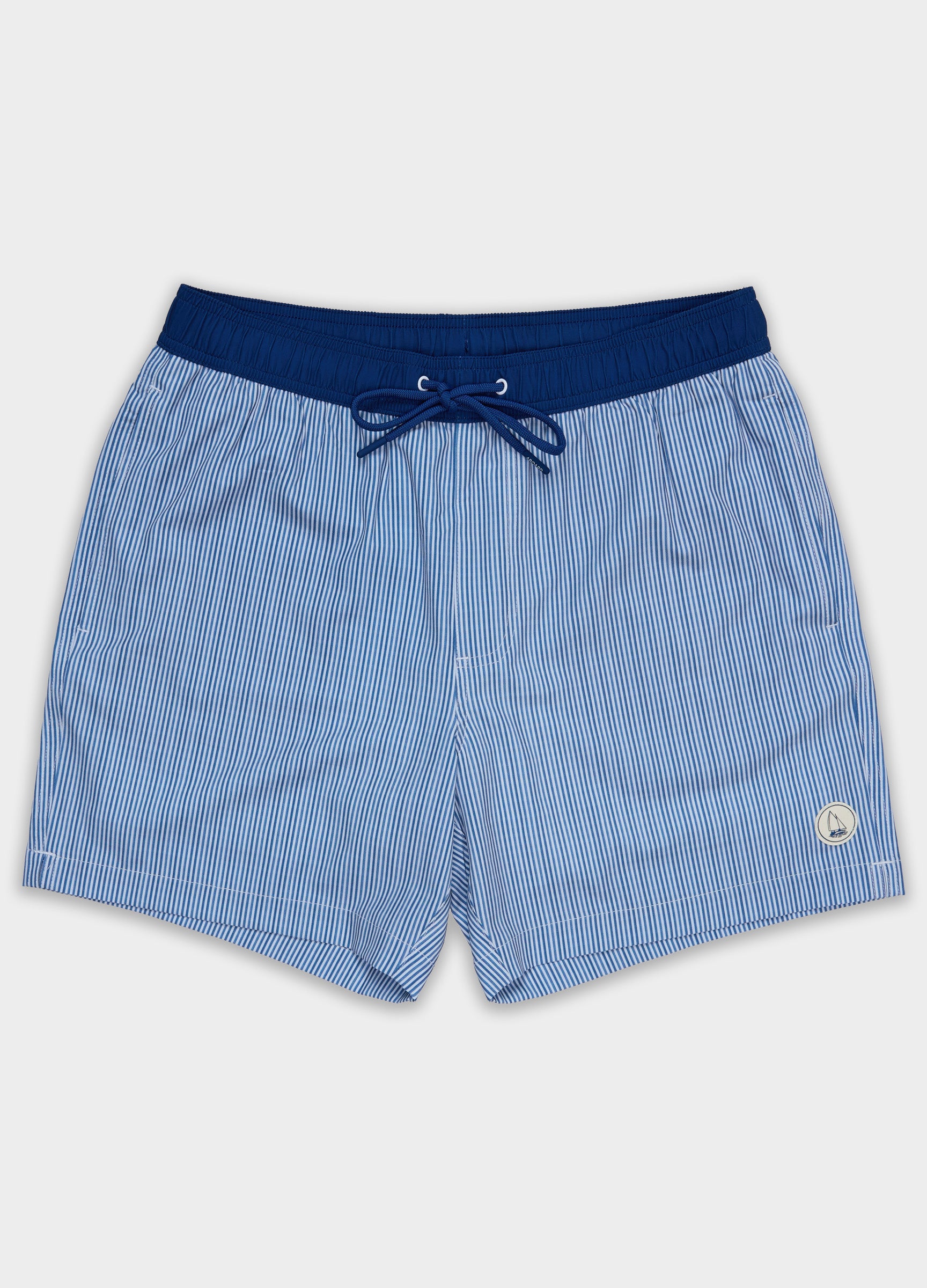 Noosa Swim Short flat lay showing front design, subtle stripes, and tailored shape