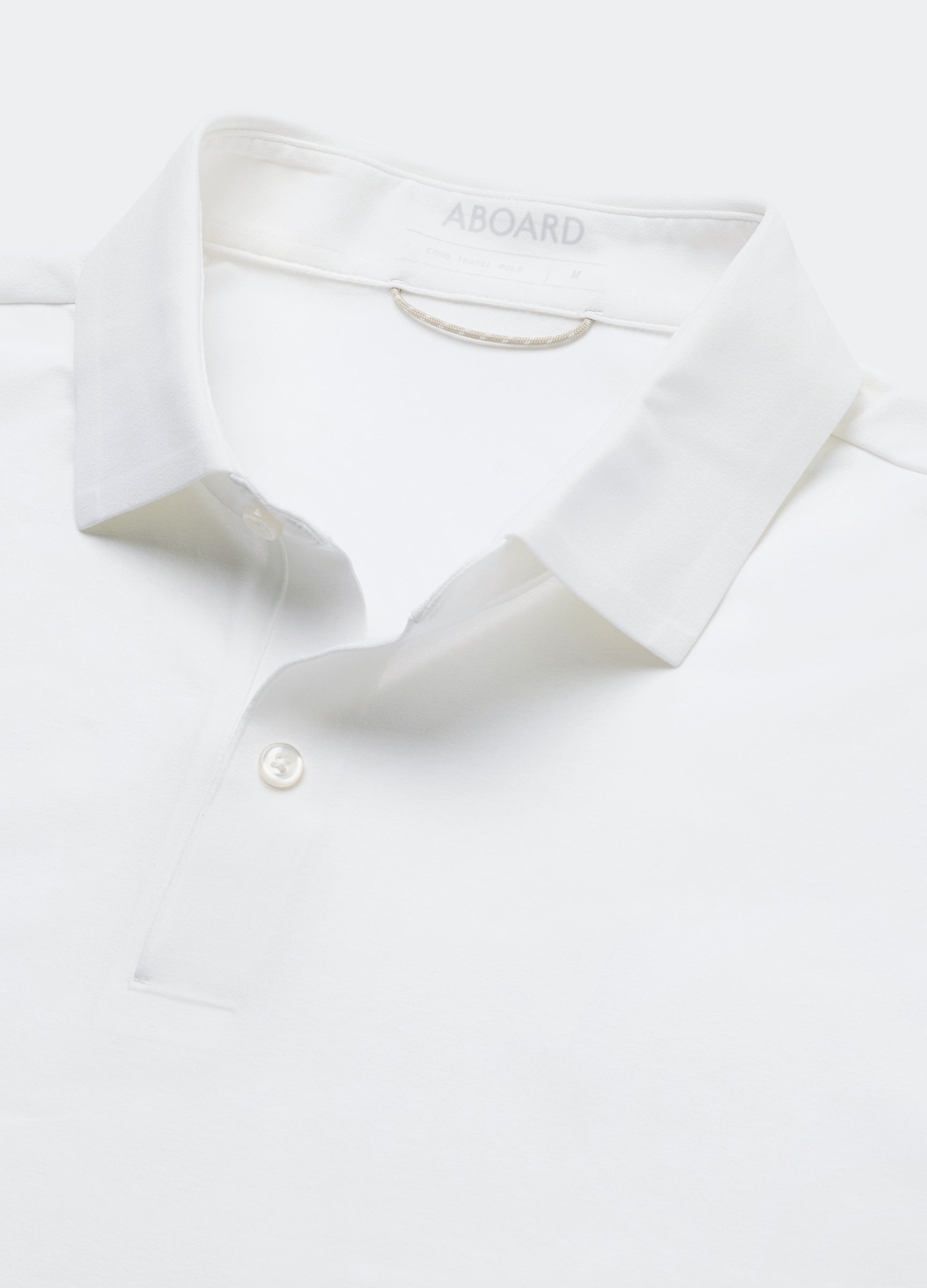 Como Long Sleeve Travel Polo in White – Collar Detail Flat Lay, Performance Polo with Breathable, Crease-Resistant Fabric #color_white
